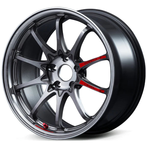 Photograph of a gunmetal gray Volk Racing CE28N-plus 10-spoke car rim isolated on white, featuring red Volk Racing branding and a red valve stem cap