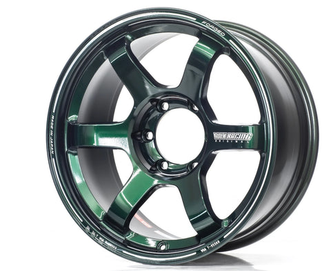 Forged dark metallic green six-spoke Volk Racing alloy wheel with visible MADE IN JAPAN and VOLK RACING ORIGINAL branding